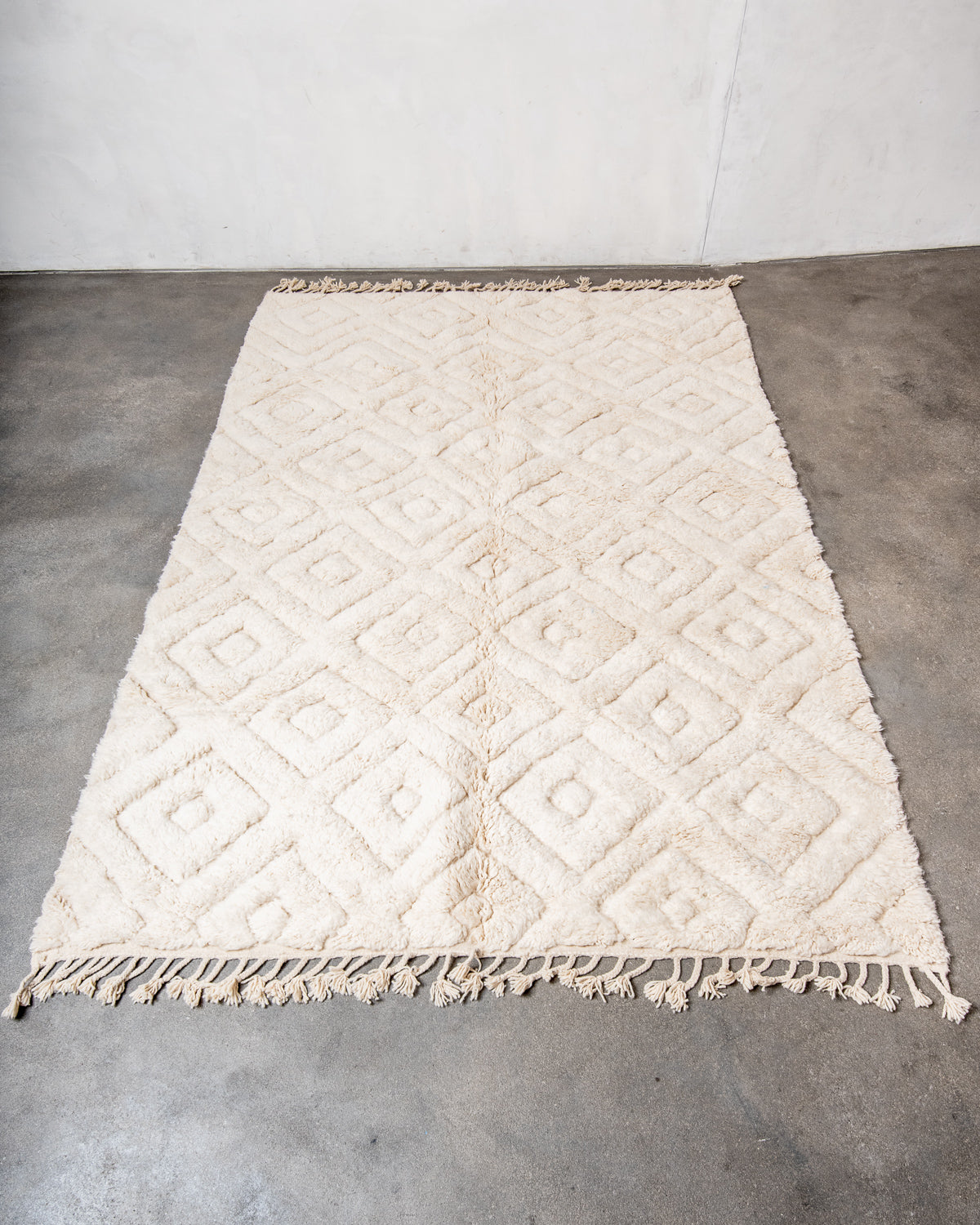 Modern, designer, handcrafted Berber rug from Morocco. Beniourain carpet with minimalist design, natural wool pile and a fluffy texture.